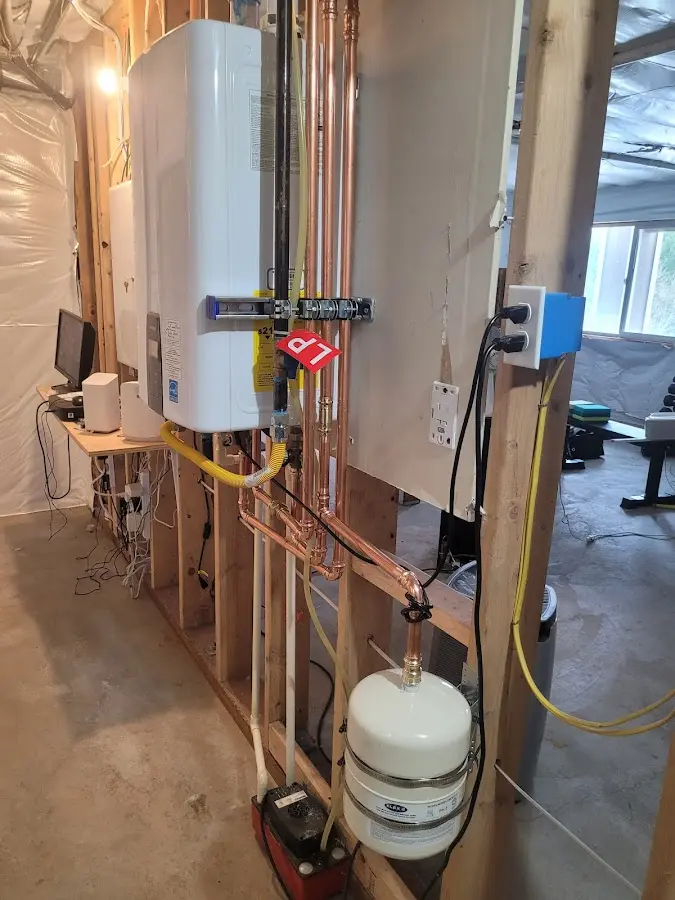 Licensed plumber repairing a kitchen sink in Juneau